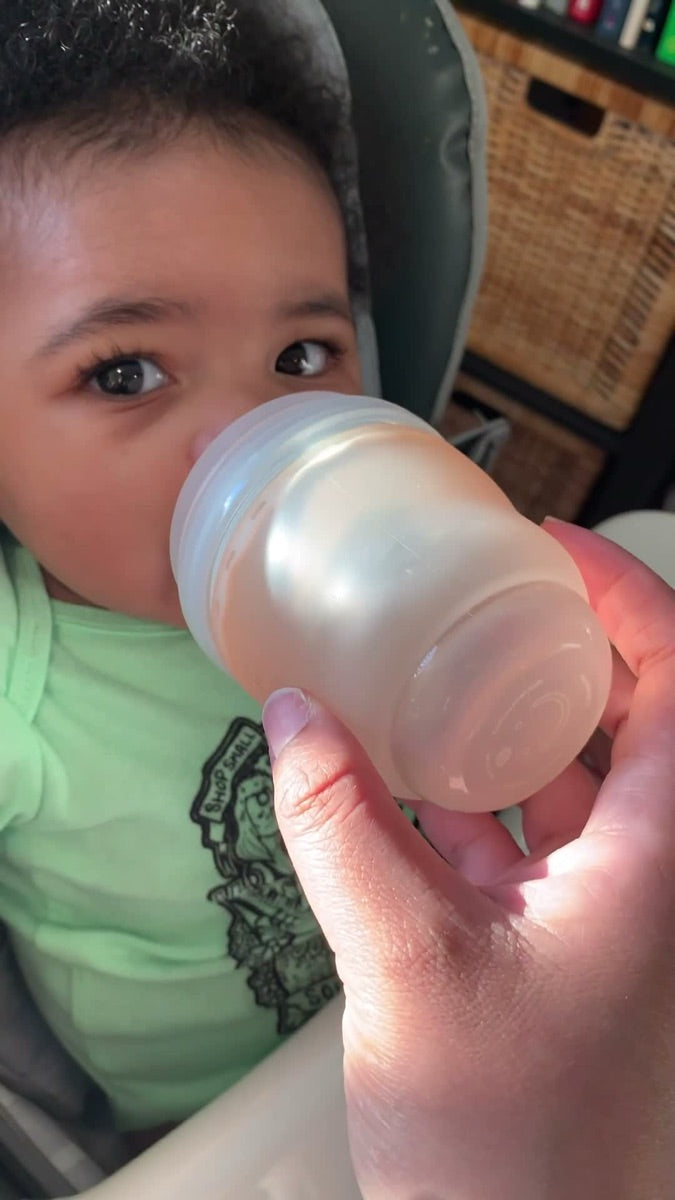 Baby drinking from the Olababy GentleBottle
