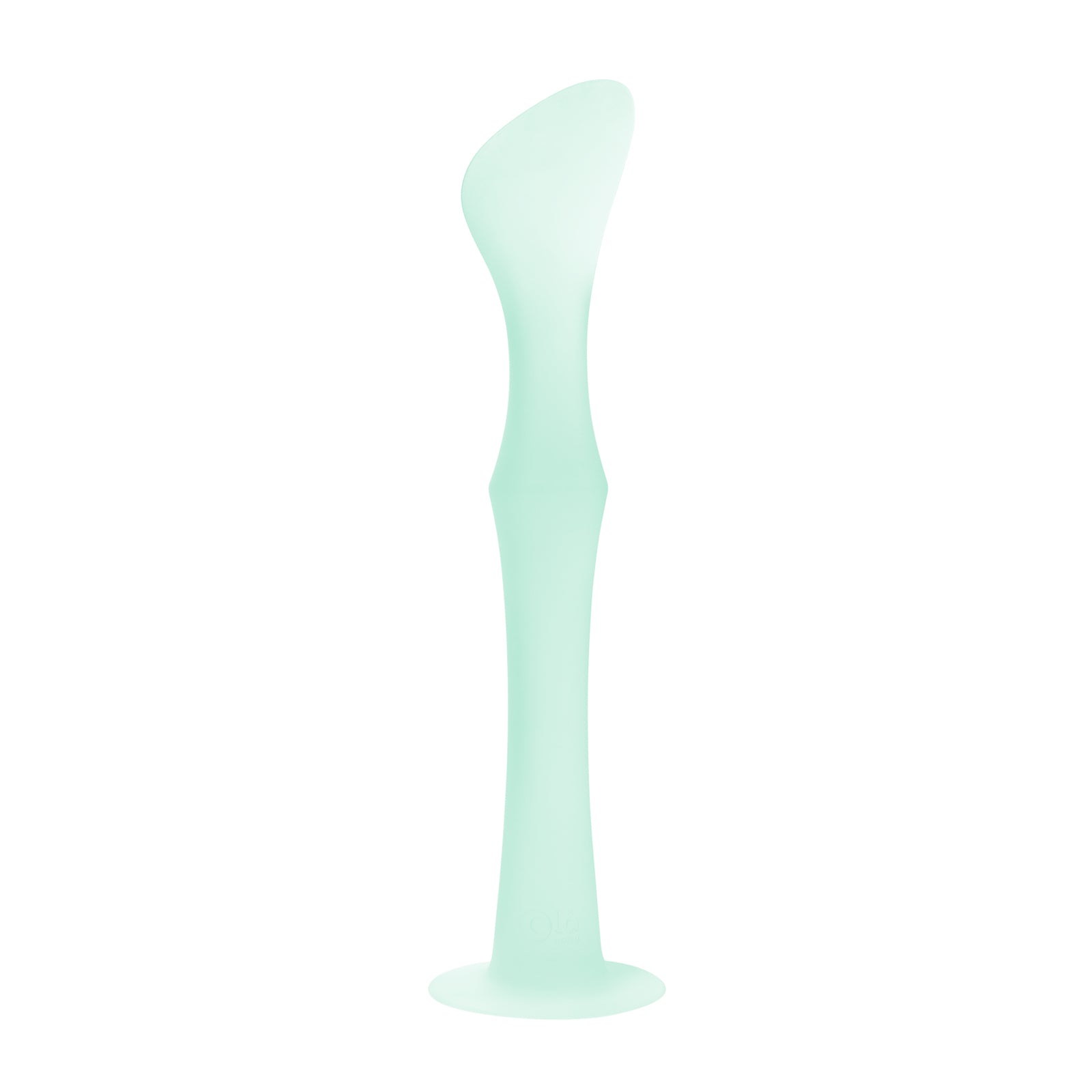 Olababy mint green silicone diaper cream applicator standing upright on its integrated suction cup base.