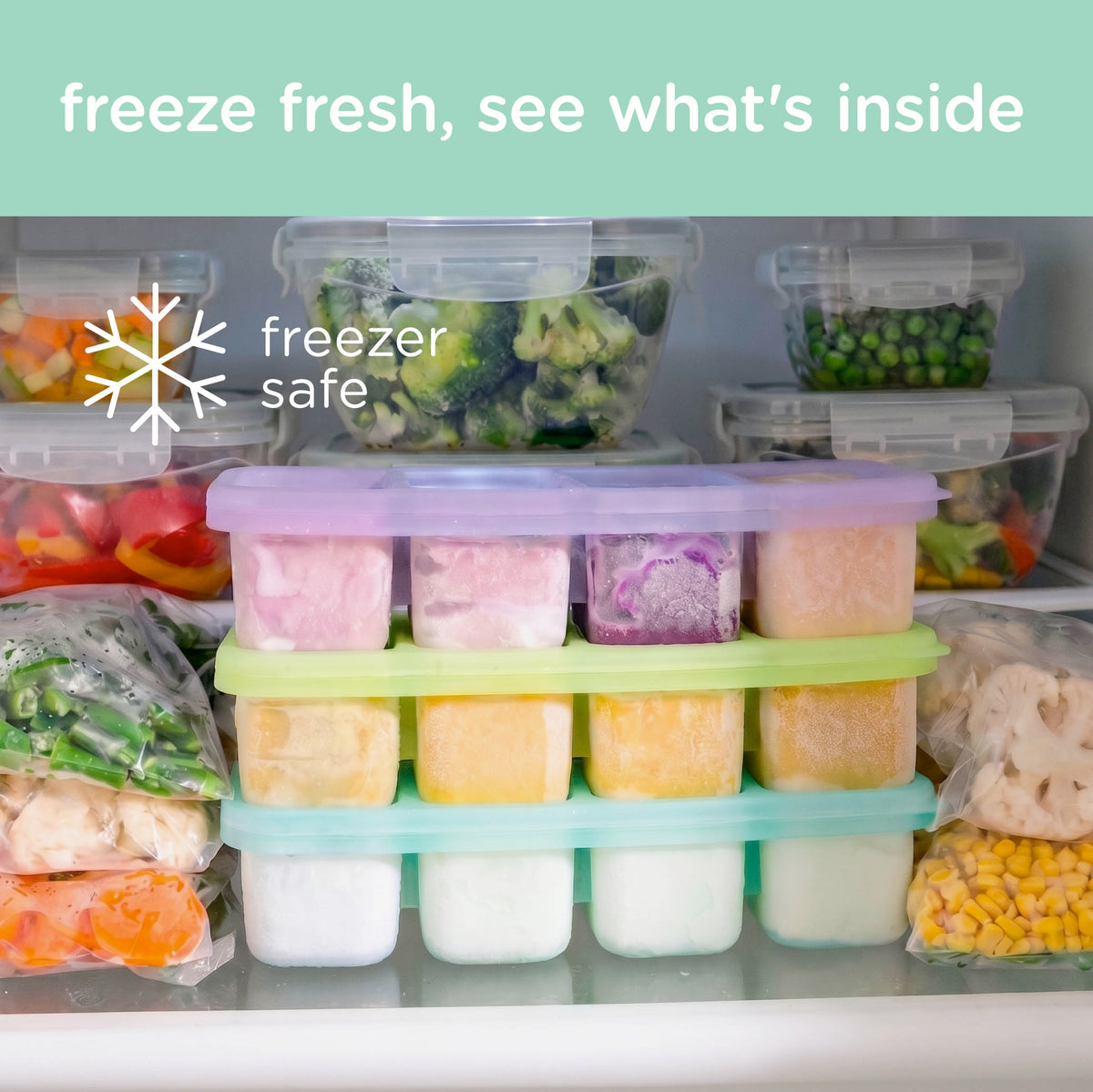 A set of colorful plastic freezer trays and containers organized on a refrigerator shelf, with frozen vegetables and packaged foods visible around them. White text at the top reads 'freeze fresh, see what's inside' and a 'freezer safe' snowflake icon appears on the left.